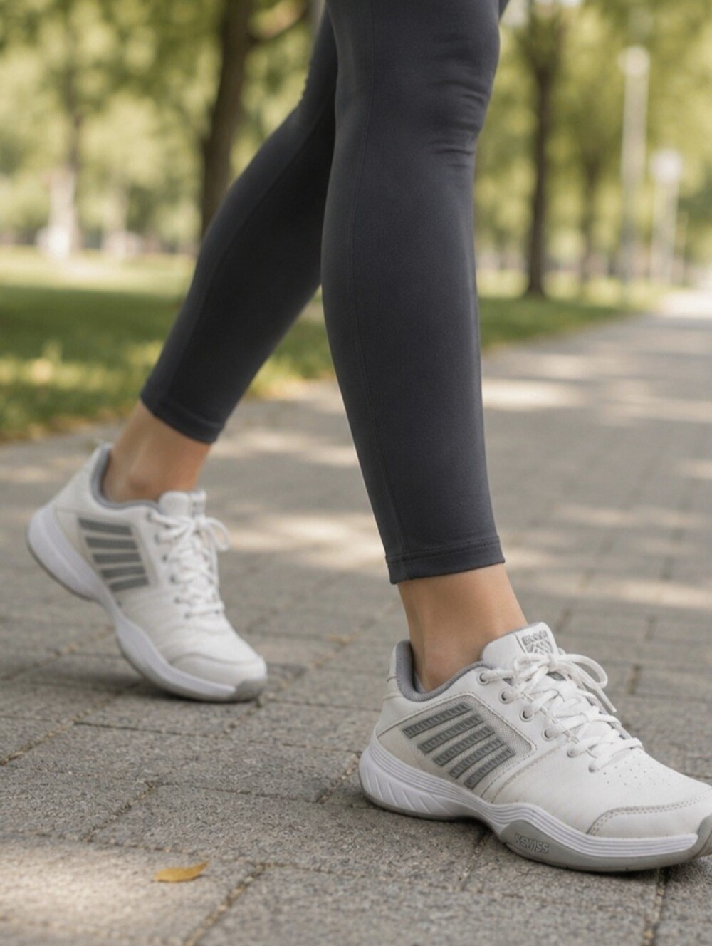 K-Swiss White Sneakers with Light Gray Stripes.